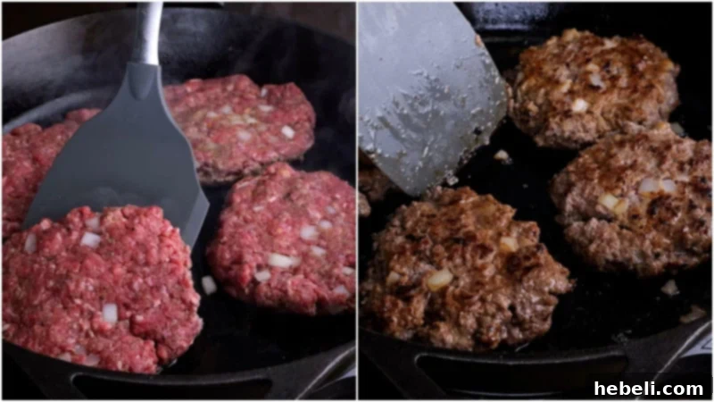 Multiple oval-shaped hamburger steak patties searing in a hot nonstick skillet, achieving a perfect golden-brown crust on their surface.