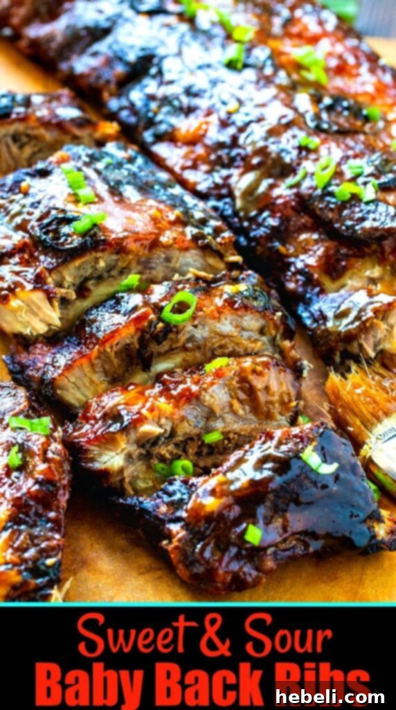 Sticky Sweet & Sour Ribs 6 A beautiful serving of Sweet and Sour Baby Back Ribs garnished with fresh green onions, ready for a delightful meal.