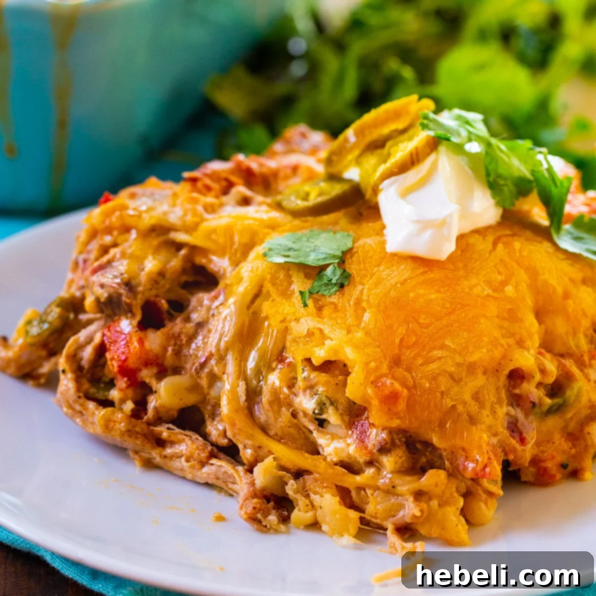 Ultimate Pulled Pork King Ranch Casserole 2 Slice of Pulled Pork King Ranch Casserole on a plate.