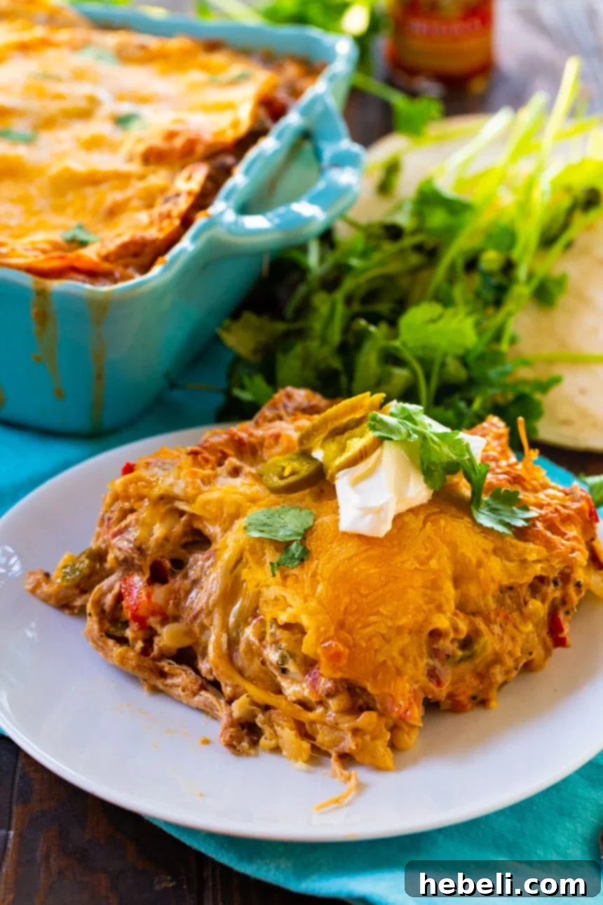 Ultimate Pulled Pork King Ranch Casserole 4 Slice of King Ranch Casserole on a plate.