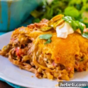 Slice of Pulled Pork King Ranch Casserole on a plate.