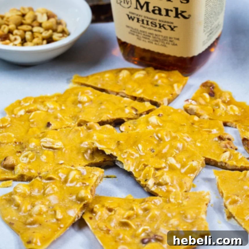Delicious pieces of homemade Bourbon Peanut Brittle, showcasing its crunchy texture and nutty goodness.