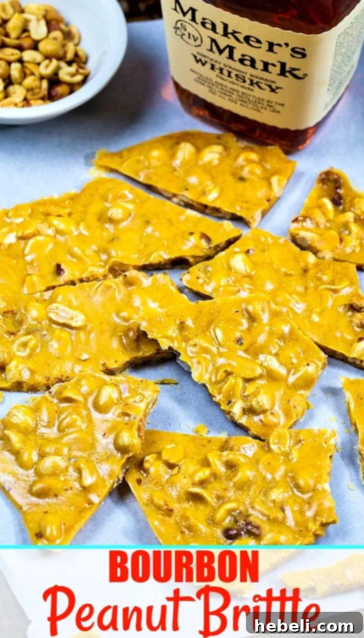 A large piece of golden Bourbon Peanut Brittle, showcasing its enticing color and texture.