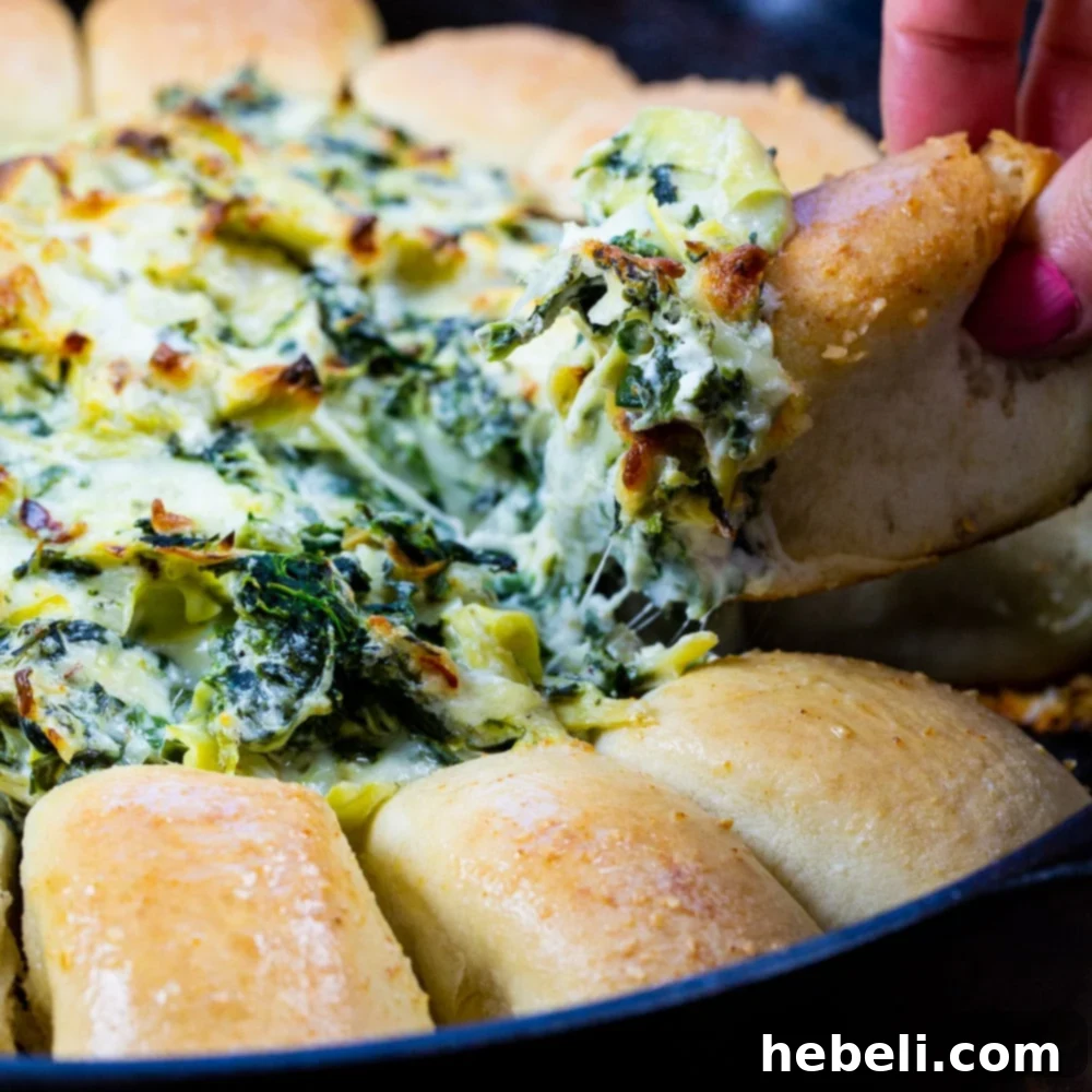 Spinach Artichoke Pull Apart Bread Ring 2 Bread Ring with Spinach Artichoke Dip in the middle, ready to be served.
