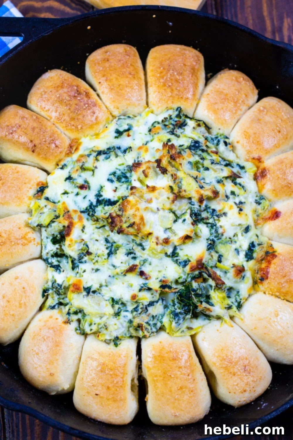 Spinach Artichoke Pull Apart Bread Ring 3 Spinach Artichoke Dip Bread Ring baked in a rustic cast iron skillet.