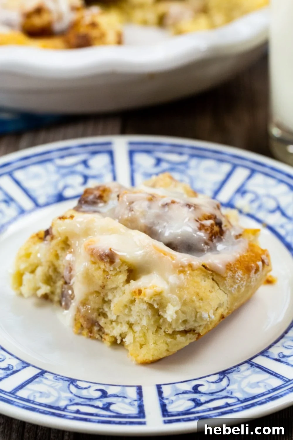 A single, perfectly glazed Bisquick Cinnamon Roll, showcasing its fluffy texture and sweet topping, ready to be enjoyed.