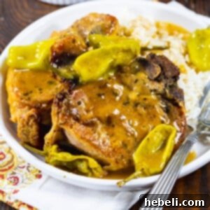 Two Slow Cooker Mississippi Pork Chops on a plate.