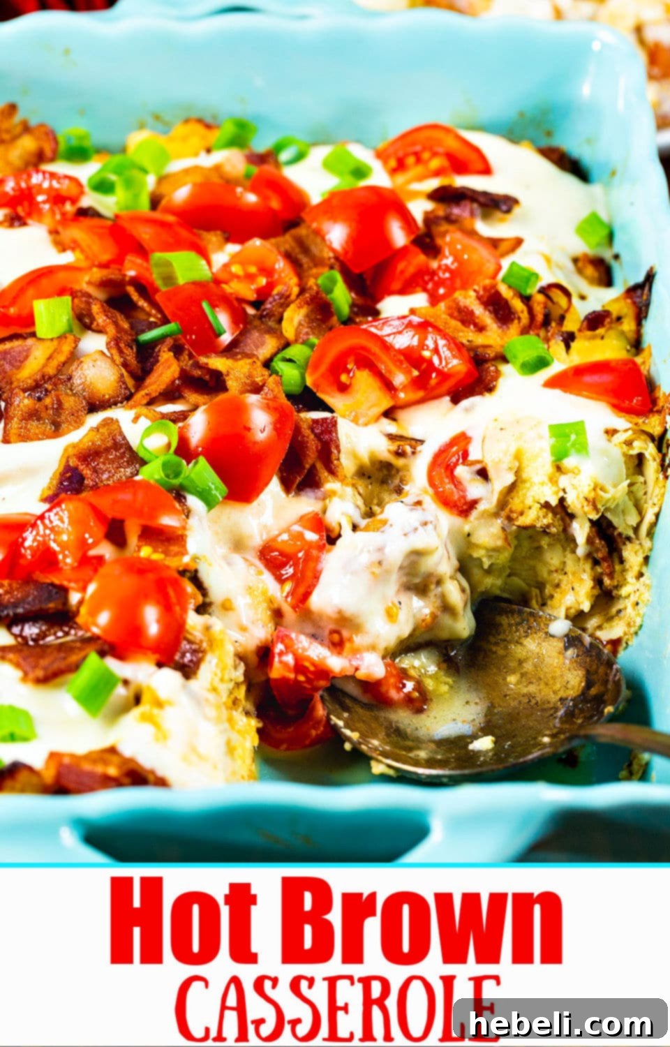Hot Brown Casserole with a vibrant garnish of sliced green onions, capturing its golden-brown top and rich texture.