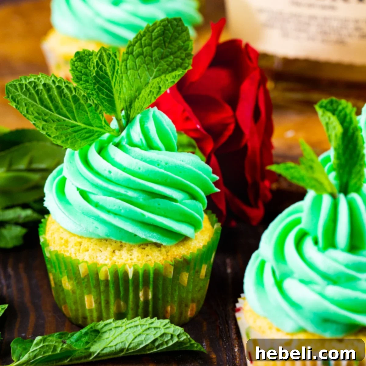 Mint Julep Cupcakes topped with vibrant mint sprigs, ready for a festive celebration.