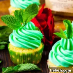 Mint Julep Cupcakes topped with mint sprigs.