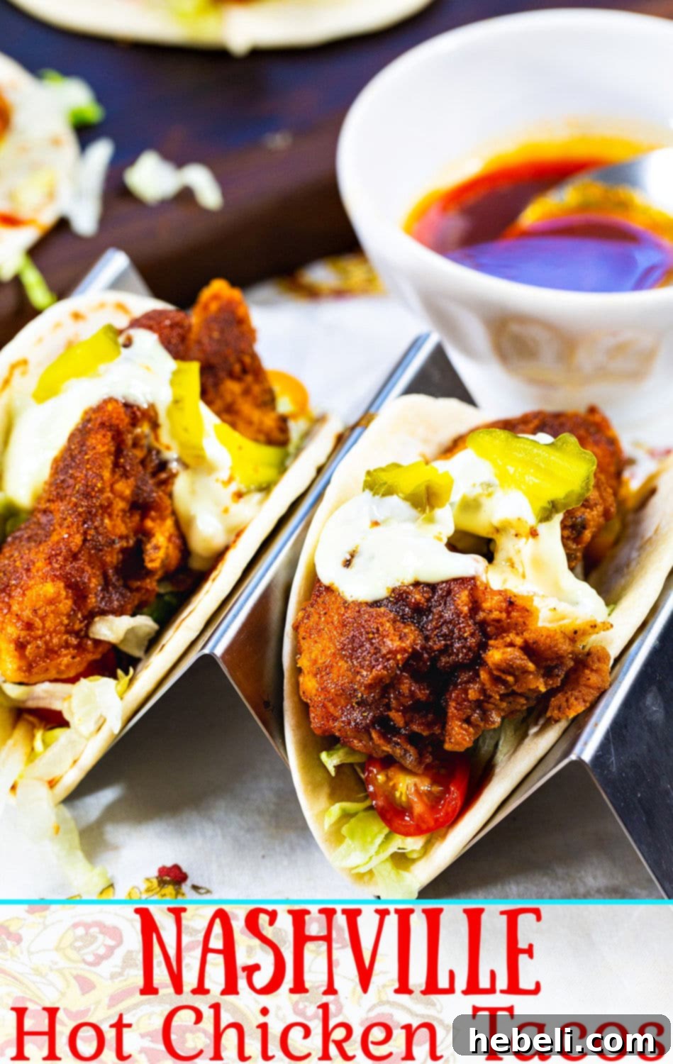 Blazing Nashville Chicken Tacos 6 Close-up of Nashville Hot Chicken Tacos with creamy sauce and pickles.