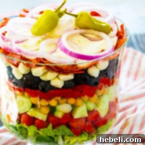 Italian Layered Salad in a trifle bowl.