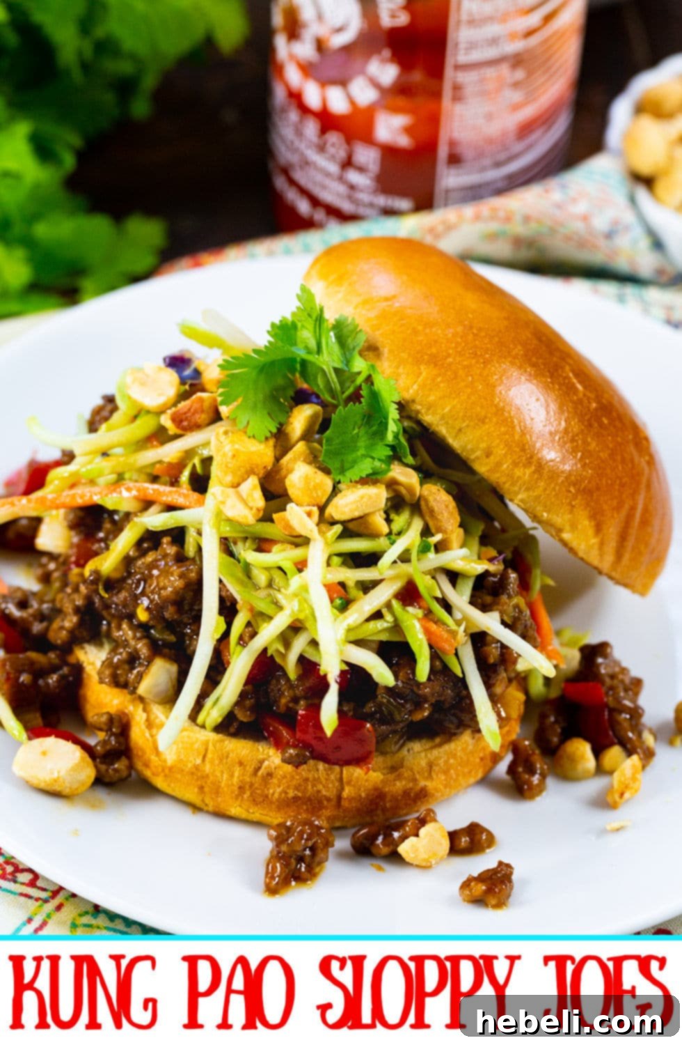 An appetizing single Kung Pao Sloppy Joe on a plate, showcasing its vibrant layers and textures.