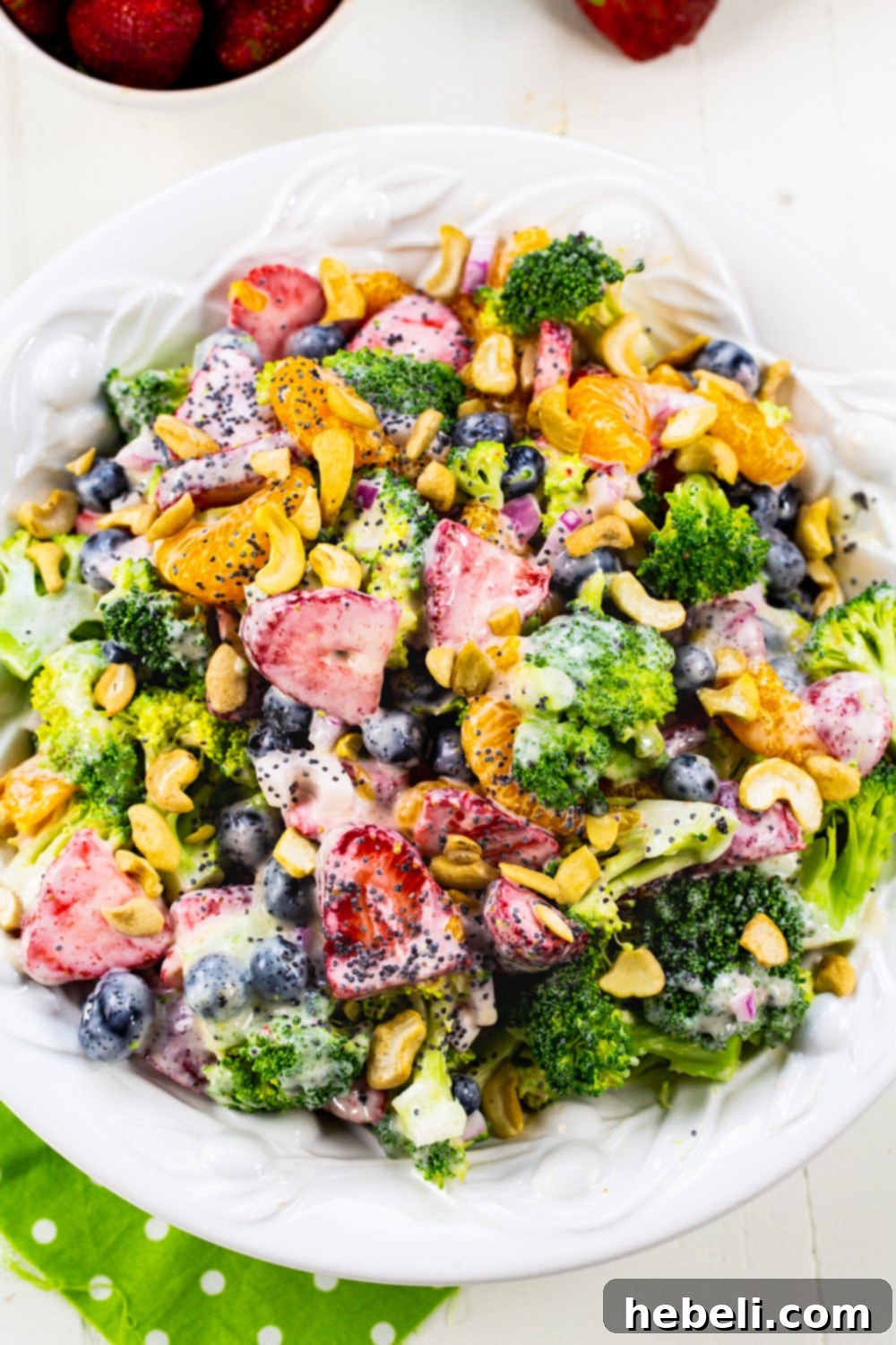 Berry Florets Fusion 3 Overhead view of Broccoli Strawberry Salad in a serving bowl, highlighting the colorful mix of blueberries, strawberries, and mandarin oranges.