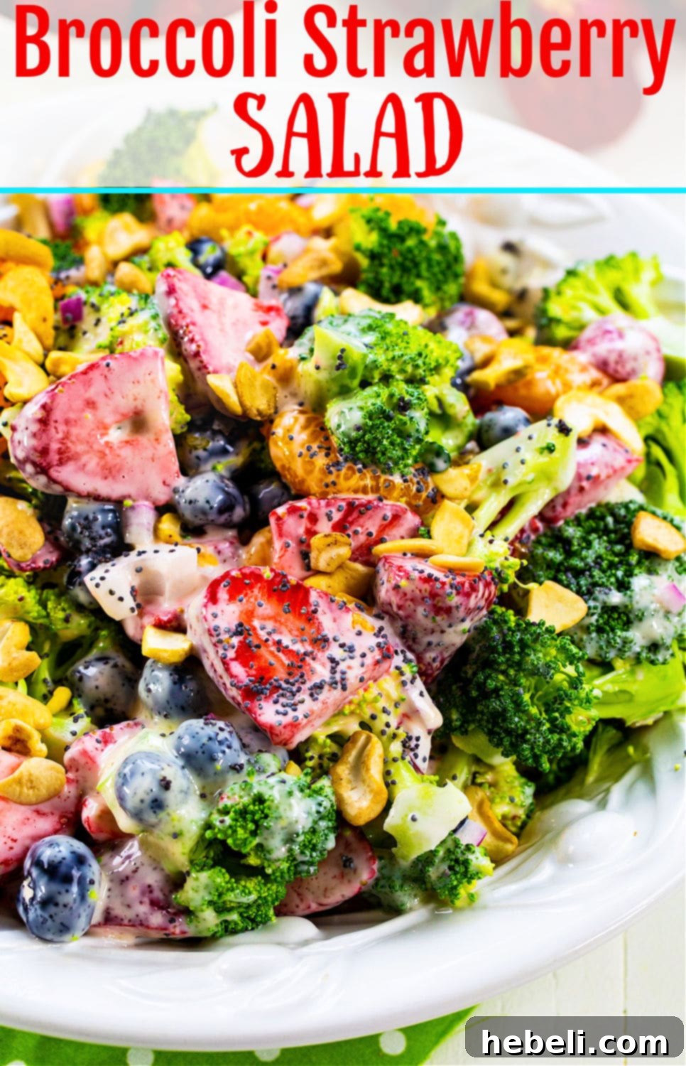 Berry Florets Fusion 6 A large serving bowl filled with Broccoli Strawberry Salad, garnished with whole strawberries and fresh mint.