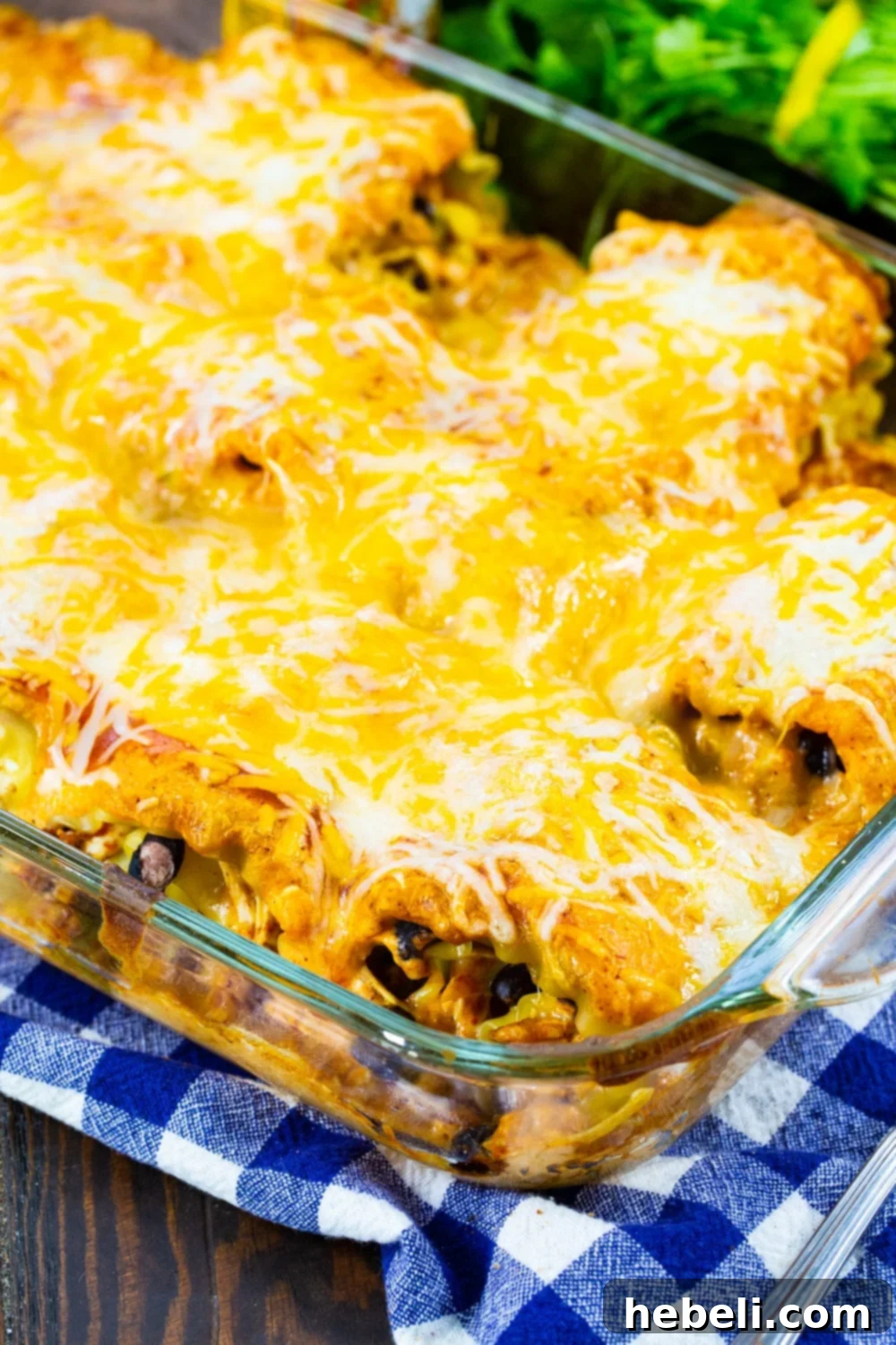 Tex-Mex Chicken Lasagna Pinwheels 5 A baking dish filled with fully assembled Southwestern Chicken Lasagna Roll-Ups, covered in creamy enchilada sauce and topped with shredded cheese, freshly out of the oven and piping hot.