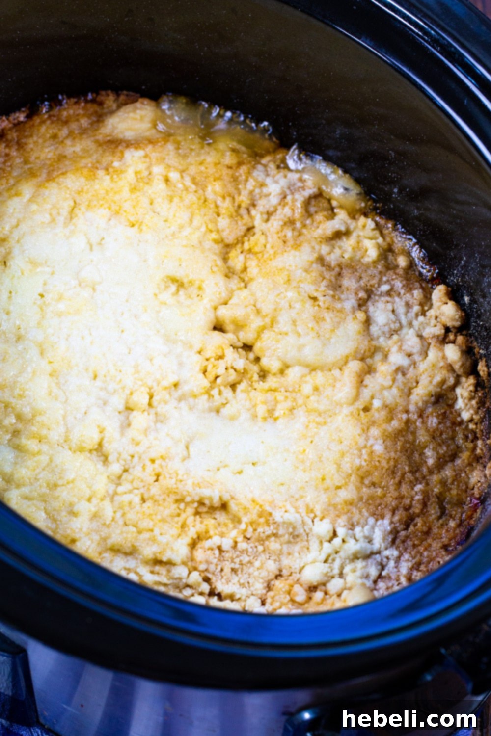 Cooked Peaches and Cream Cake in slow cooker.