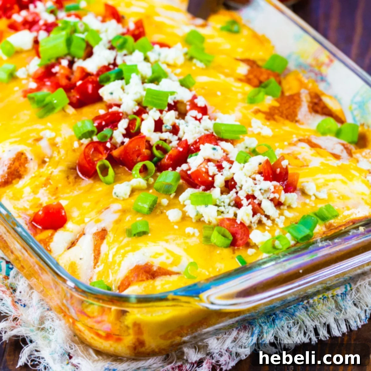 Zesty Buffalo Chicken Enchiladas 2 Buffalo Chicken Enchiladas in a 9x13-inch baking dish.