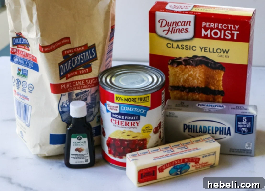 Ingredients for Cherries and Cream Dump Cake laid out on a table.