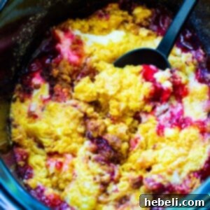 Crock Pot Cherries and Cream Dump Cake in slow cooker.