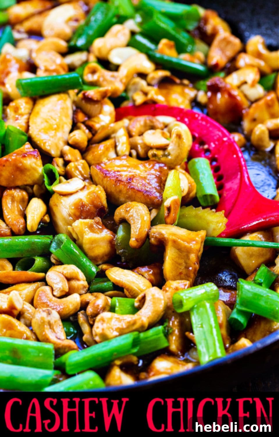 Classic Cashew Chicken 6 A large nonstick skillet filled with Cashew Chicken, freshly cooked and ready to be served, showing the rich, glossy sauce.