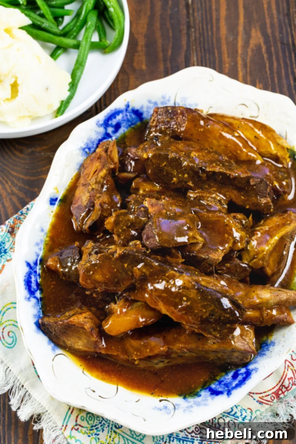 Sweet and Sour Ribs presented beautifully on a serving platter with garnishes.