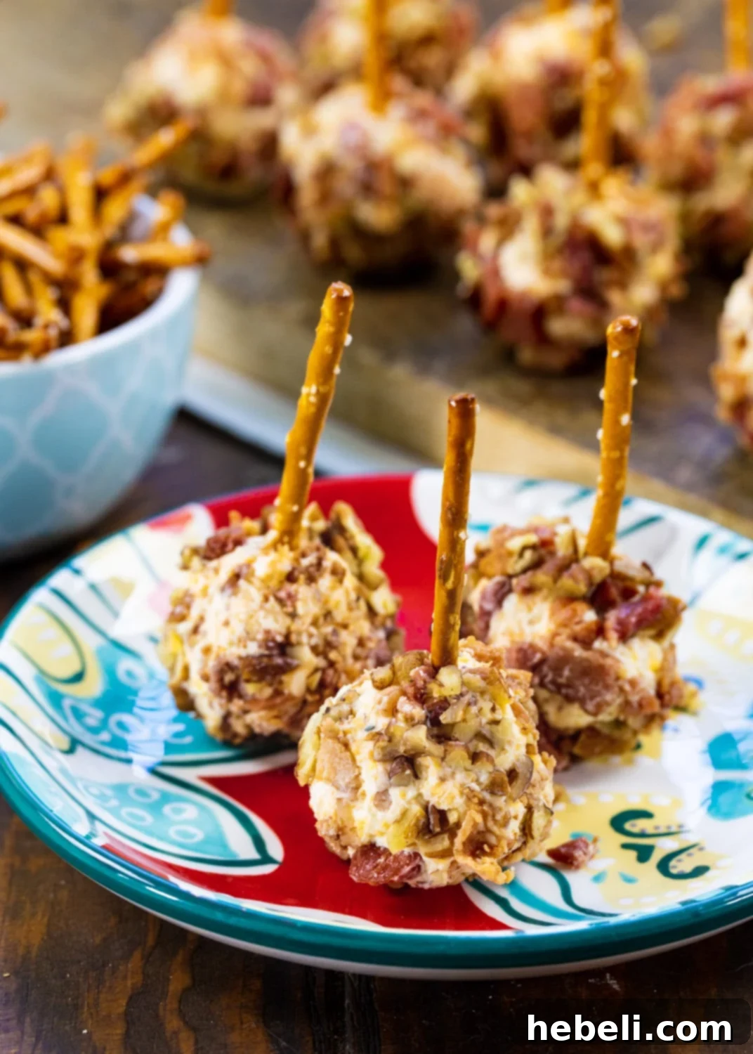 Bacon Cheese Ball Delights 4 Three Bacon Cheese Ball Bites on a blue and red plate, ready for serving.