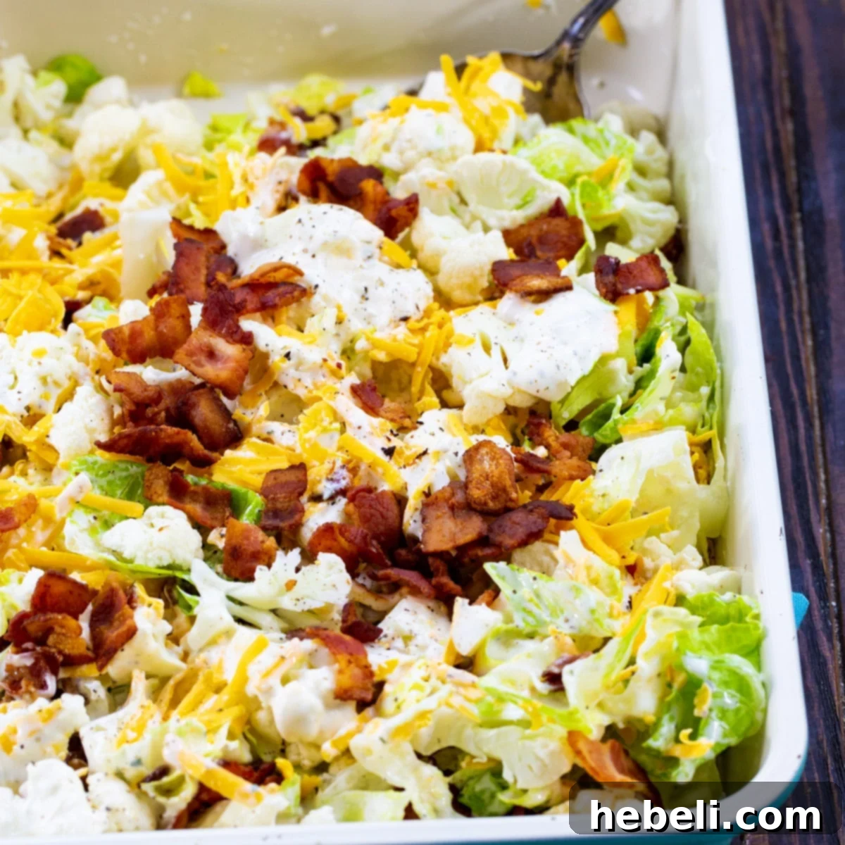 Creamy Bacon Ranch Cauliflower Crunch 2 Bacon and Ranch Cauliflower Salad in a 9x13-inch pan, showcasing its vibrant ingredients.