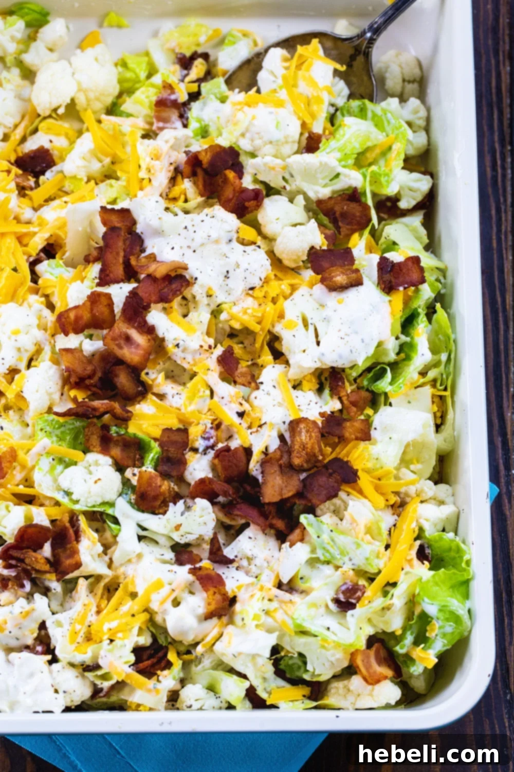 Creamy Bacon Ranch Cauliflower Crunch 3 Cauliflower Salad in a 9x13-inch pan, showing its rich texture and colors.