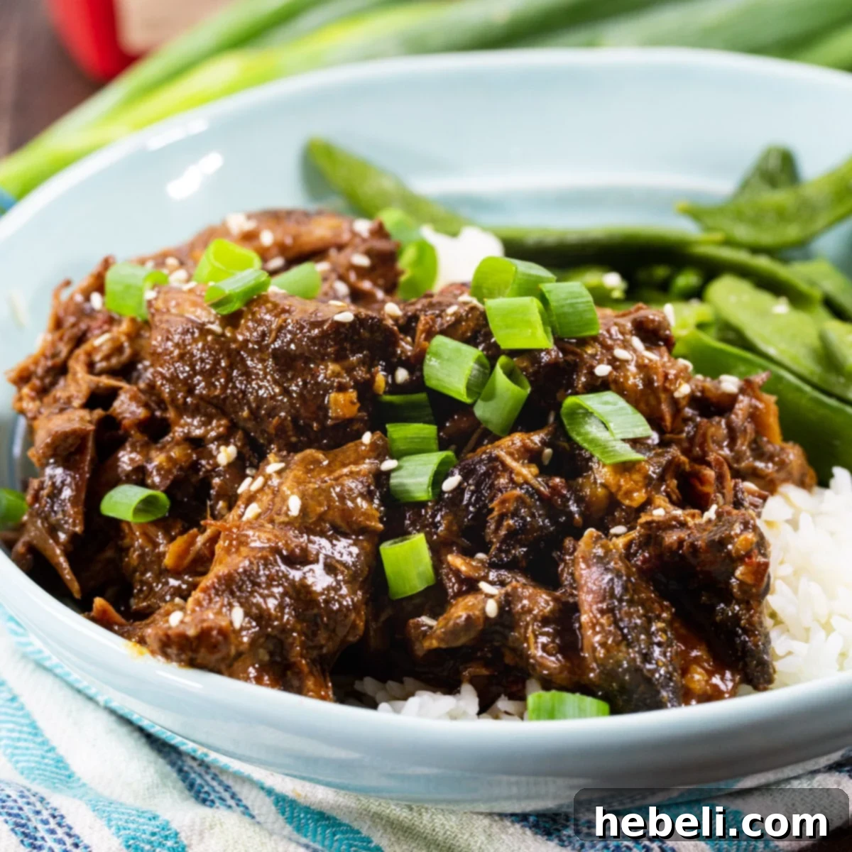Tender Slow Cooker Korean Beef 2 Korean Beef served over white rice.
