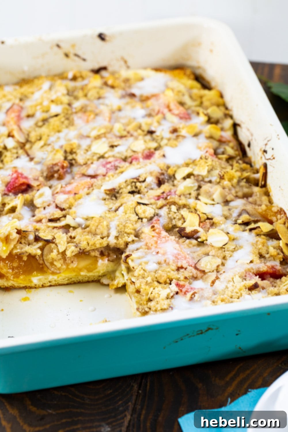 Luscious Peach Cream Crescent Bars 6 Peaches and Cream Crescent Bars in a 9x13-inch baking dish, sliced into squares.