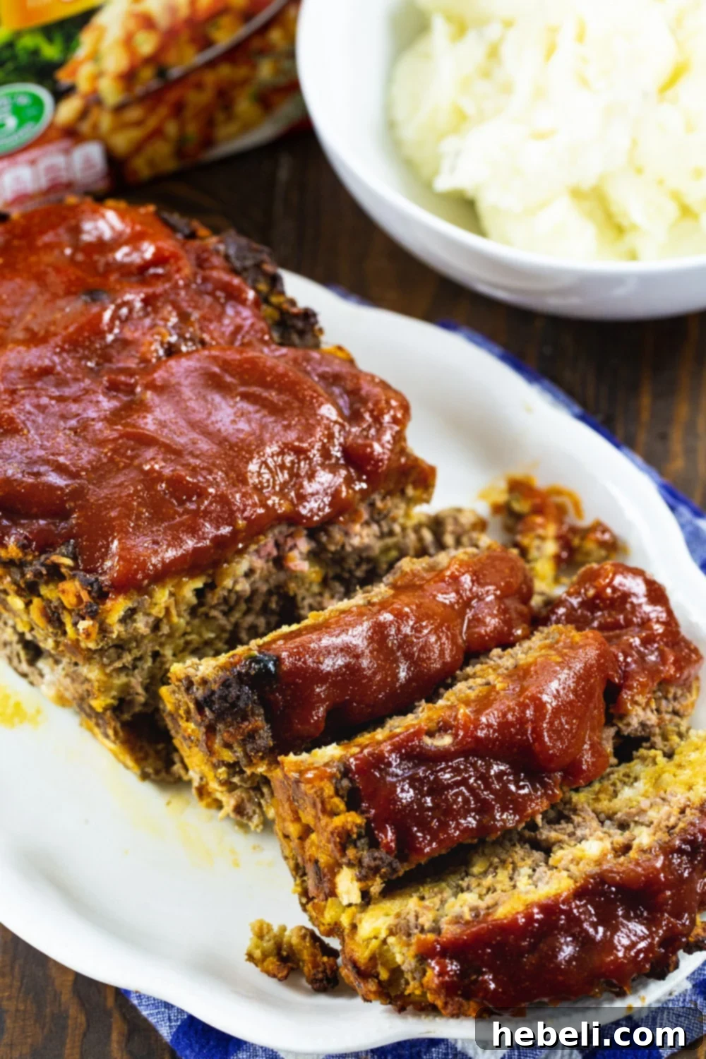 Stove Top Meatloaf cut into slices on a serving platter.