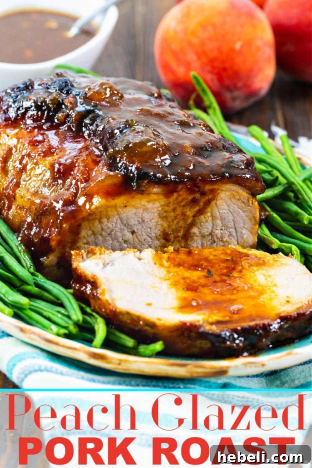Sweet Peach Pork Perfection 5 A beautifully presented Peach Glazed Pork Roast, showing its luscious glaze and tender texture, with a serving fork ready to carve.