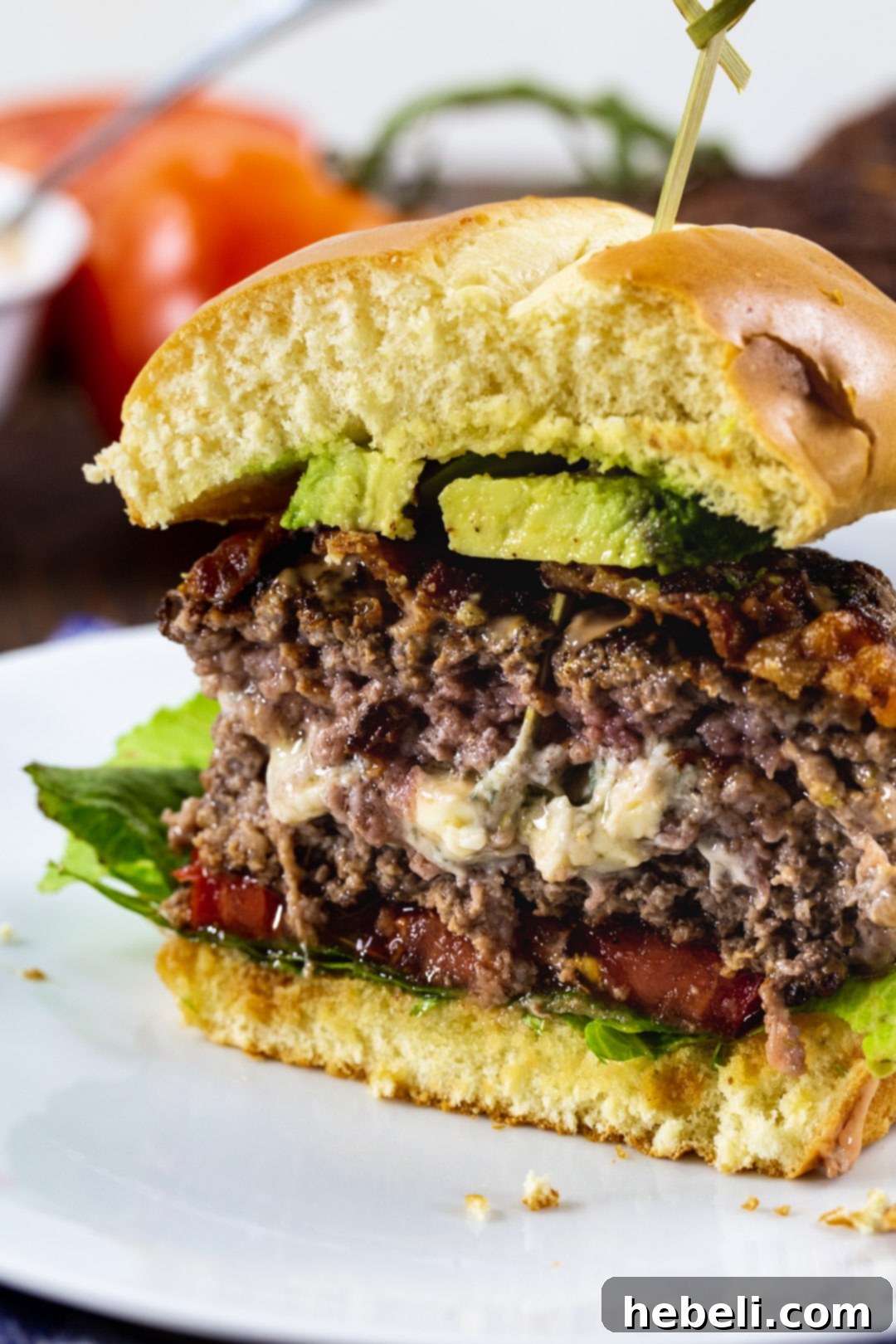 Black and Blue Burgers cut in half to show melted blue cheese on the inside.