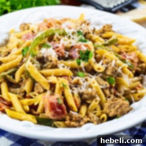 Creamy Cajun Sausage Pasta in a serving bowl, perfectly cooked and garnished.