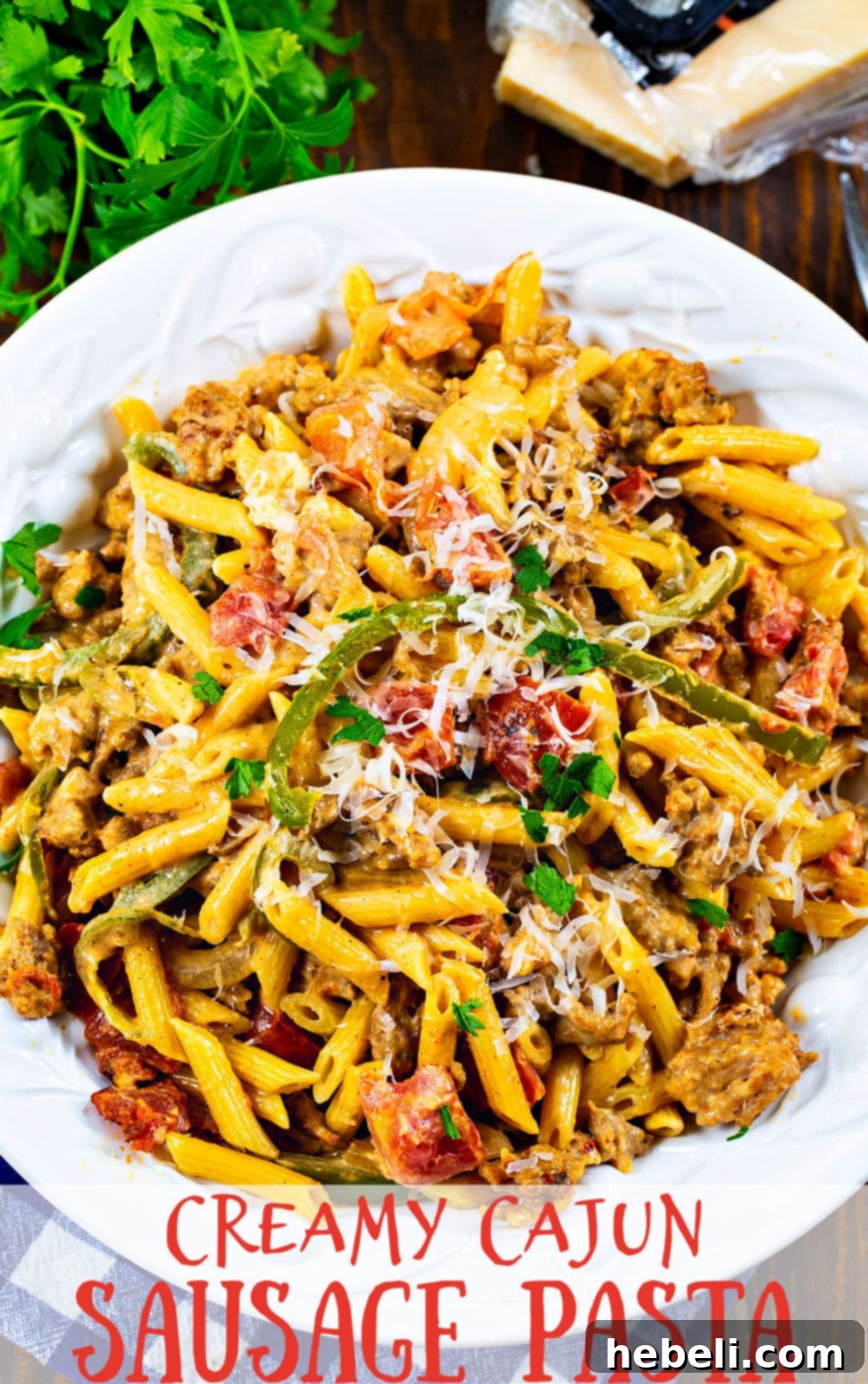 A beautifully presented bowl of Creamy Cajun Sausage Pasta, showcasing the rich sauce and vibrant ingredients in natural light.