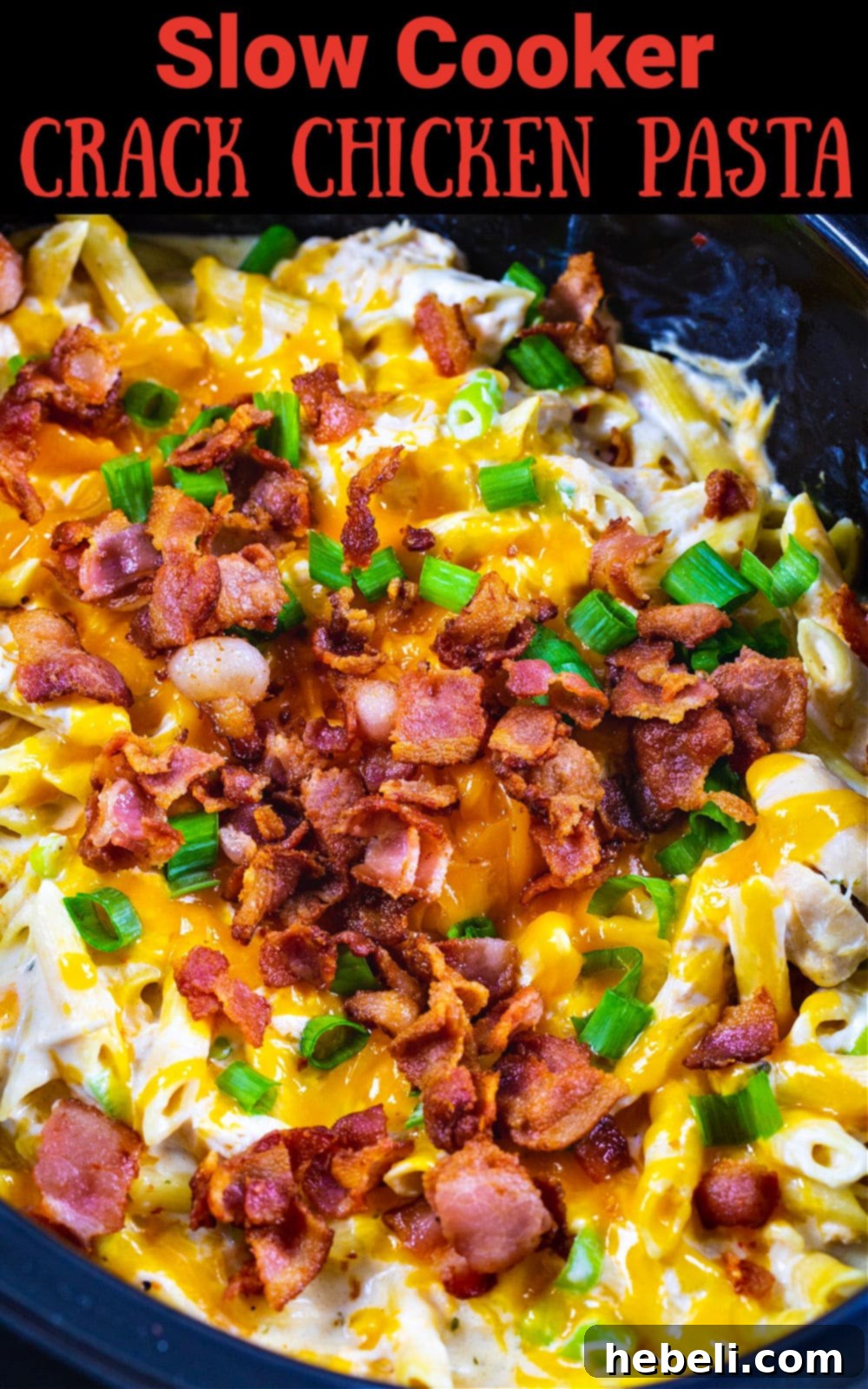 Addictive Slow Cooker Chicken Pasta 6 A delicious serving of Slow Cooker Crack Chicken Pasta garnished with fresh green onions in a crockpot.