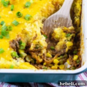A delicious Pulled Pork Shepherd's Pie, baked to perfection with a golden-brown mashed potato topping.