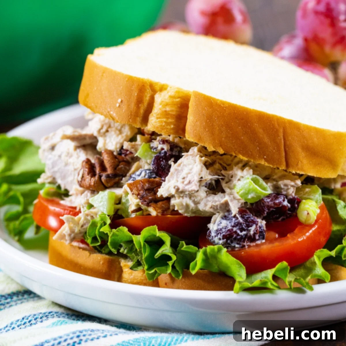 Classic Turkey Salad served in a sandwich with fresh lettuce and ripe tomato slices, making a delicious and easy lunch.