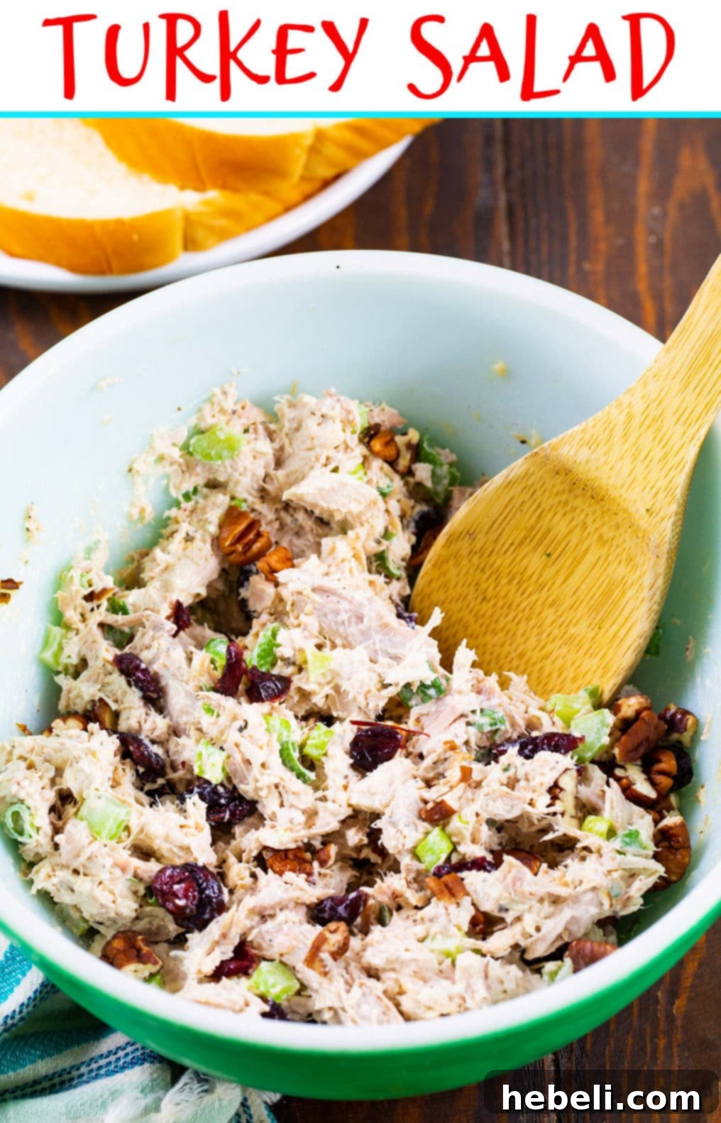 A bowl of creamy Turkey Salad, showcasing the vibrant colors of cranberries, green onions, and toasted pecans, ready to be enjoyed.