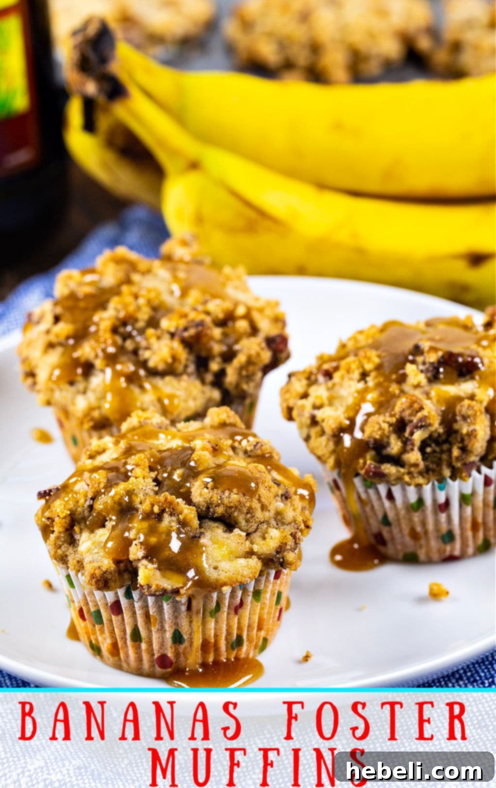 Three Bananas Foster Muffins beautifully arranged on a white plate, showcasing their inviting texture and rich caramel drizzle.
