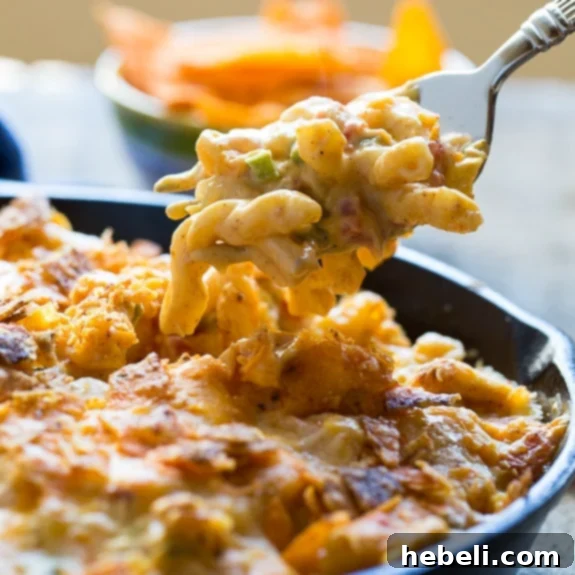 Ultimate Mac and Cheese Creations 13 King Ranch Casserole in mac and cheese form, featuring diced chicken and a crunchy crushed Dorito topping.