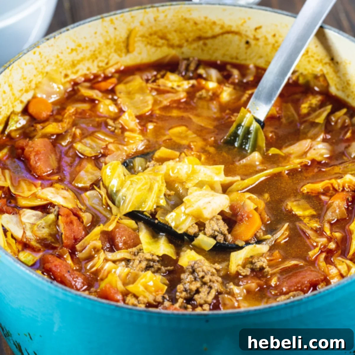 Spicy Tex-Mex Cabbage Soup 2 A steaming Dutch oven filled with Tex-Mex Cabbage Soup, ready to be served.