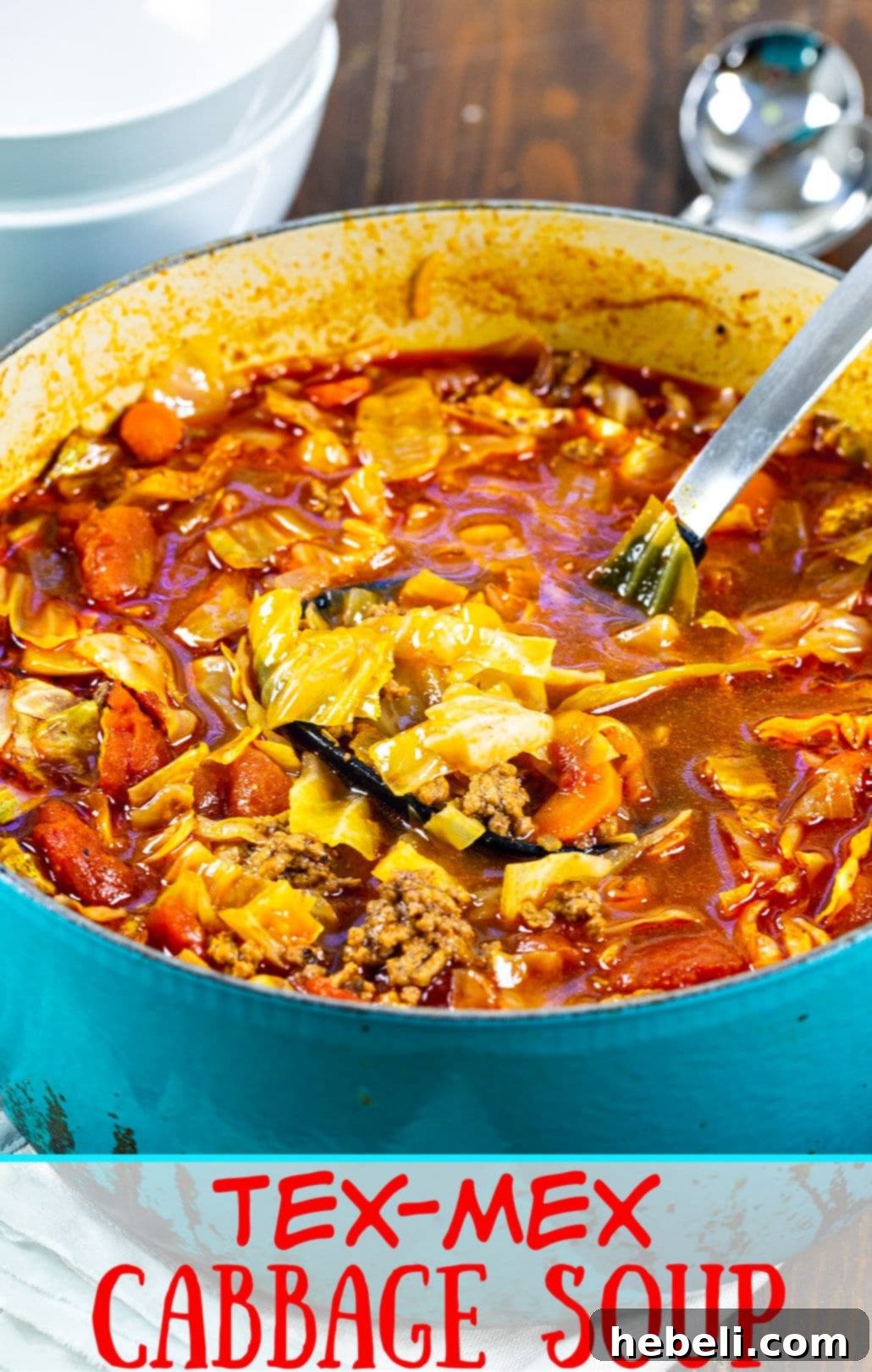 Spicy Tex-Mex Cabbage Soup 5 Tex-Mex Cabbage Soup presented in a vibrant blue Dutch oven, steaming hot and inviting.