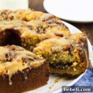 Butterscotch Streusel Coffee Cake 5 Close-up of a generous slice of Butterscotch Coffee Cake, highlighting the gooey butterscotch topping, golden crust, and crunchy pecan texture.