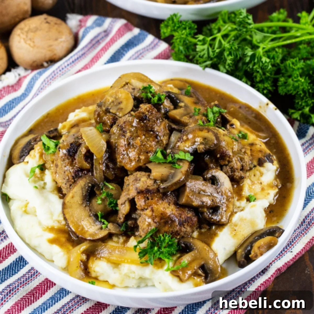 Hearty Meatloaf Meatballs with Brown Gravy served over fluffy mashed potatoes, a classic comfort meal.