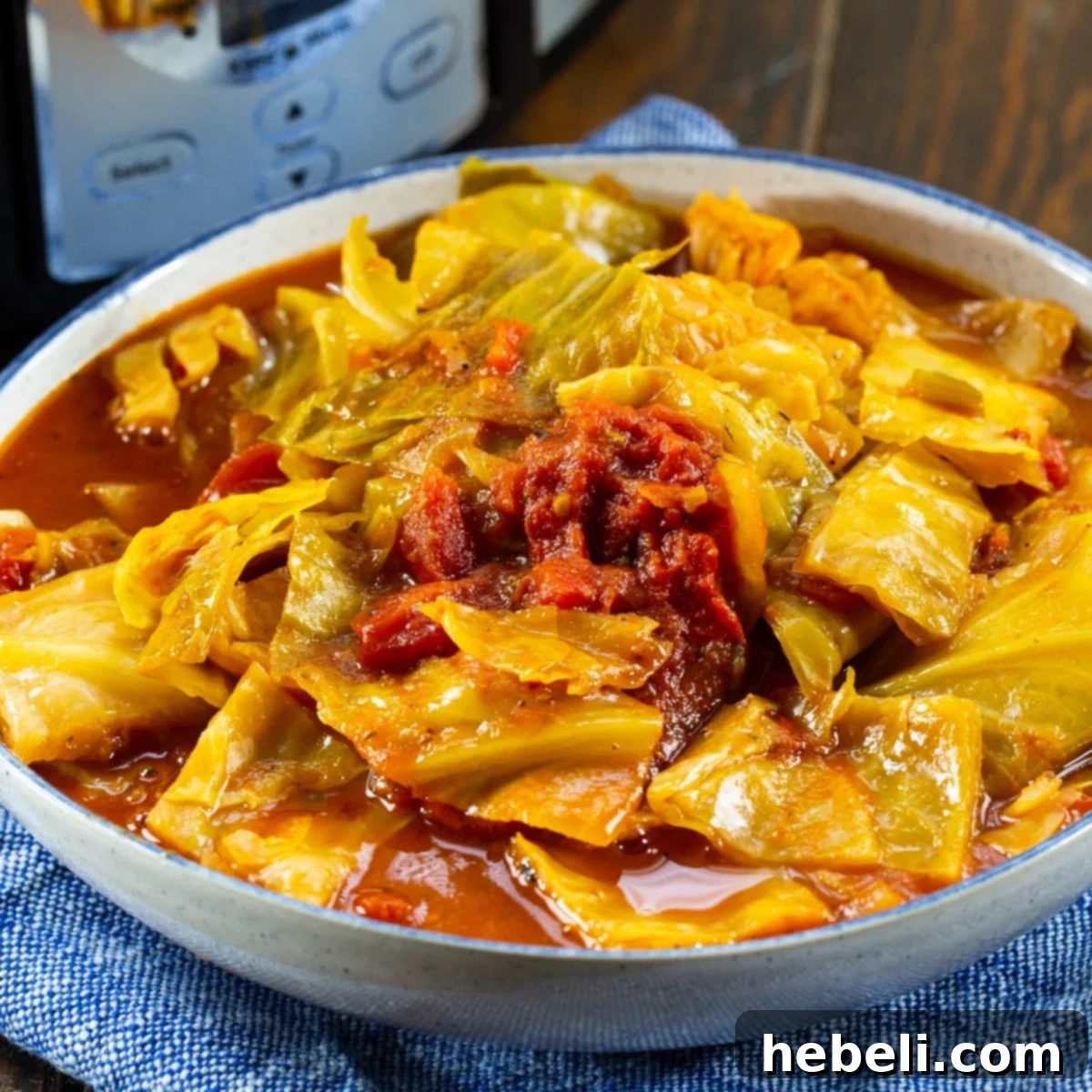 Slow Cooker Cabbage and Stewed Tomatoes in a serving bowl, ready to be enjoyed.