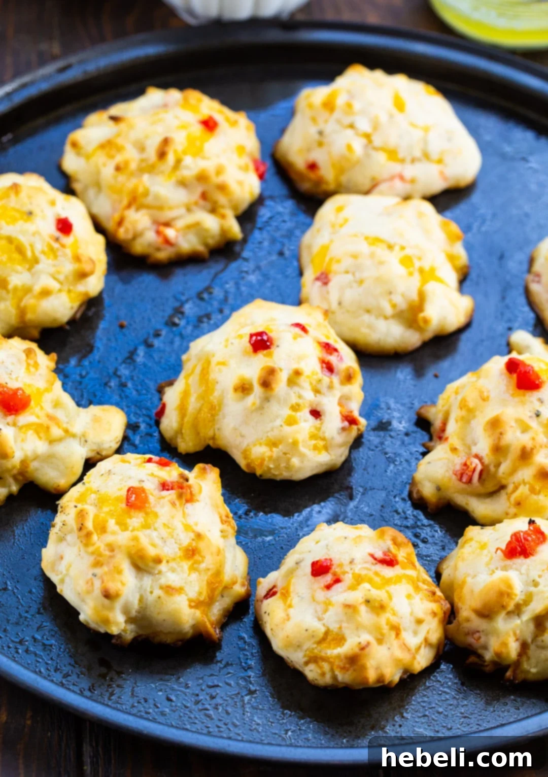 Cheesy Pimento Drop Clouds 3 Biscuits on a baking sheet.