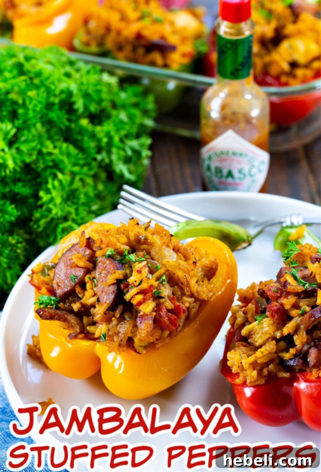 Cajun Jambalaya Stuffed Peppers 5 A single Jambalaya Stuffed Pepper on a white plate, ready to be enjoyed as a hearty meal.