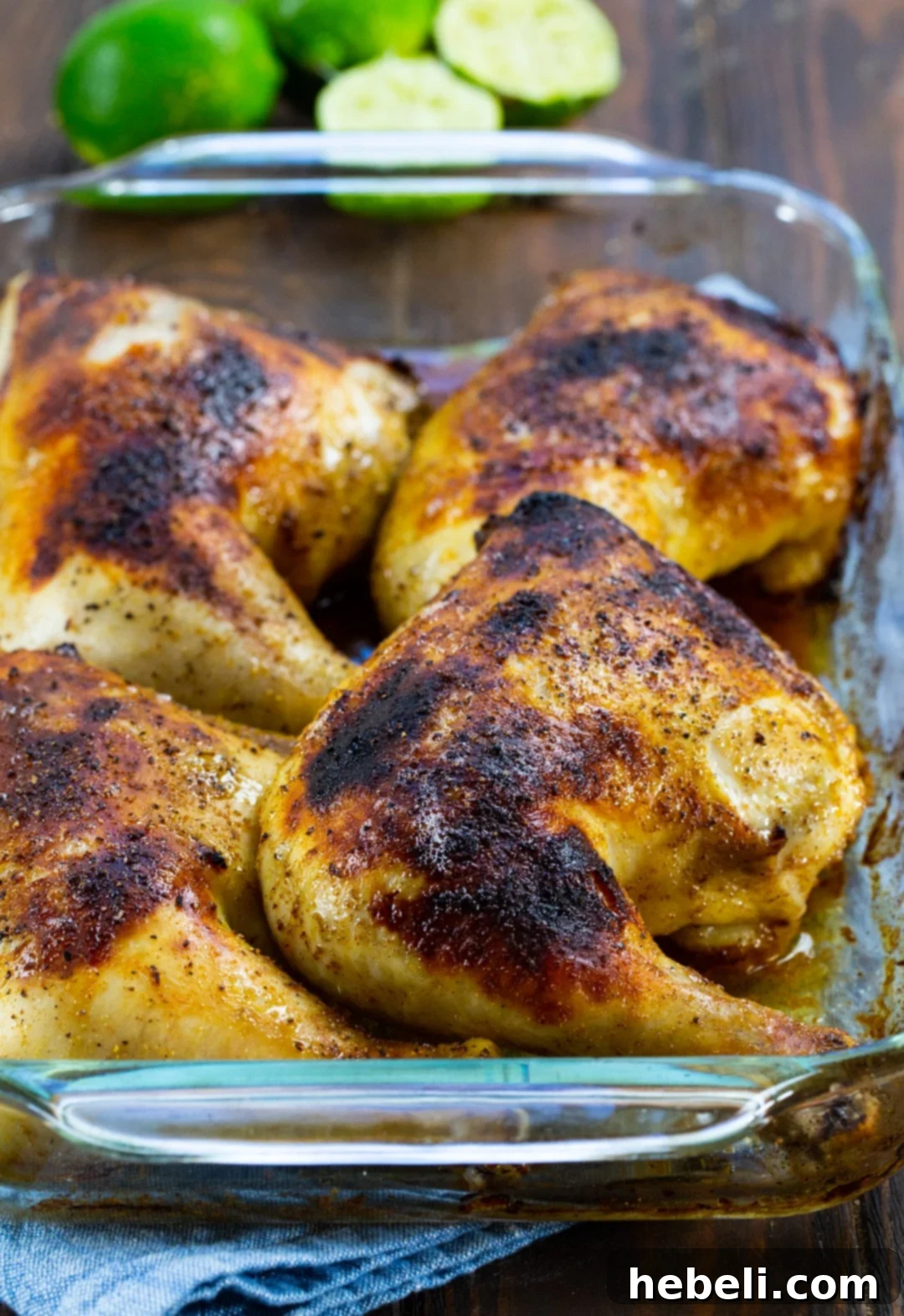 Zesty Margarita Chicken Bake 3 Margarita Chicken baking in a 9x13-inch baking dish, simmering in its marinade, golden-brown.